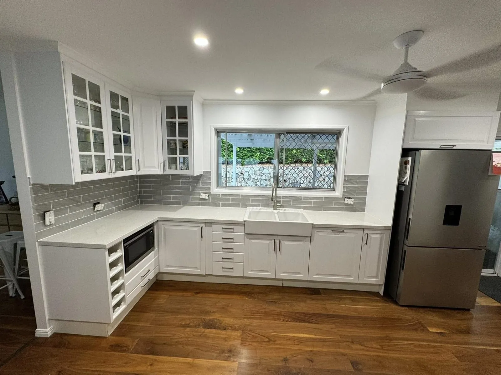 After: Kitchen cabinets repainted white