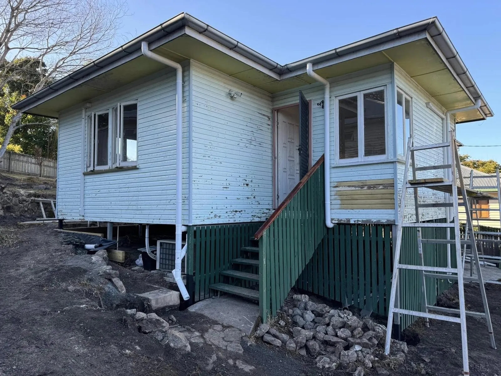 Before: Weatherboard house exterior