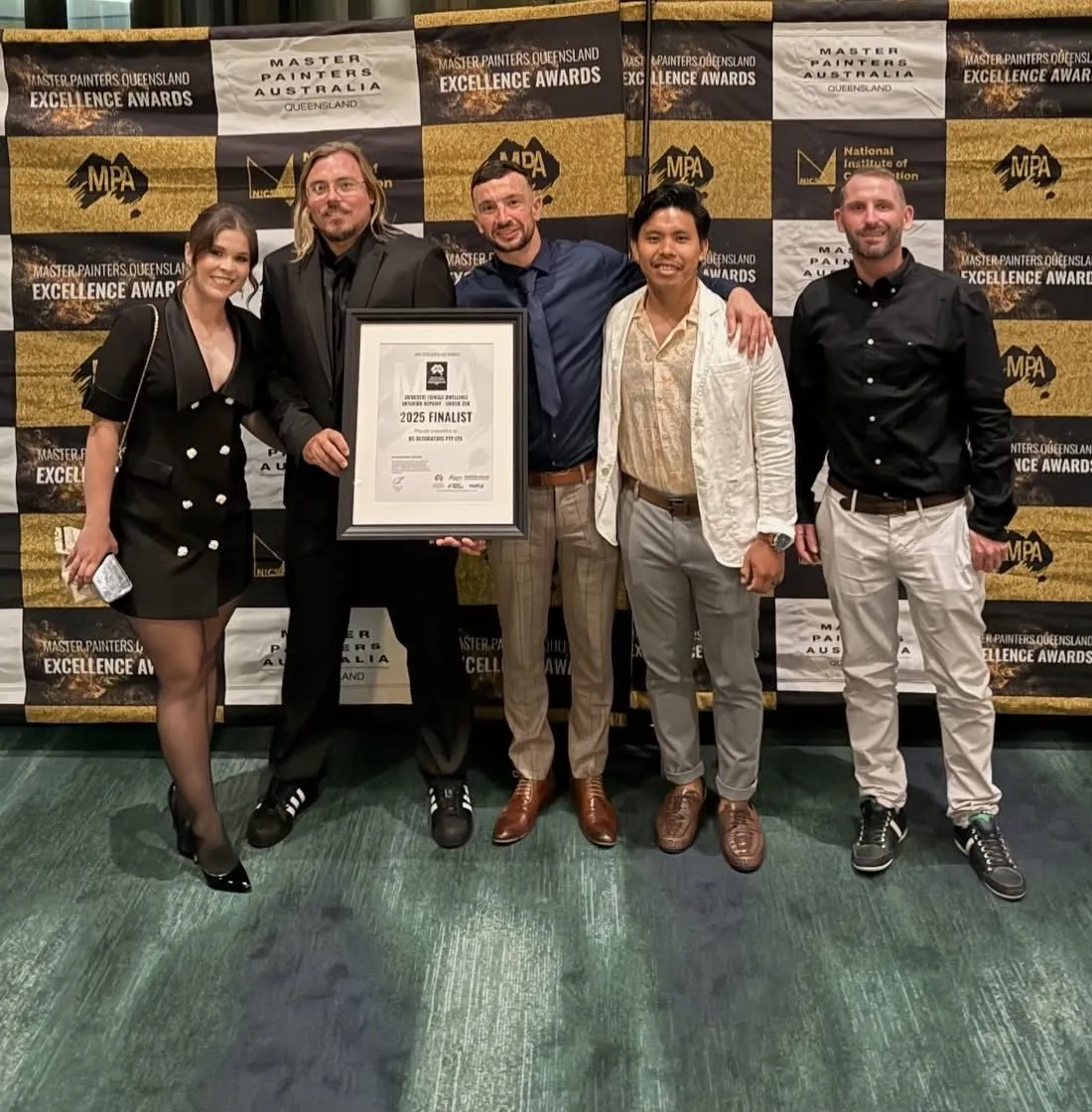 The DC Decorators team holding their 2025 finalist certificate at the Master Painters Queensland Excellence Awards